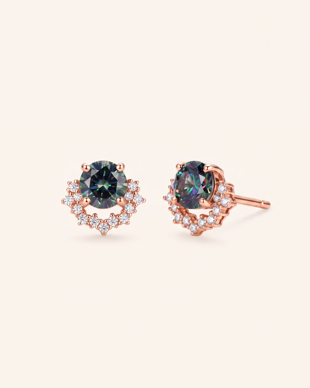 Pair of Starlight Crown Crescent Moissanite Stud Earrings in 18k rose gold vermeil featuring Celestial Teal center stones and pavé crescent halos.