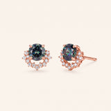 Pair of Starlight Crown Crescent Moissanite Stud Earrings in 18k rose gold vermeil featuring Celestial Teal center stones and pavé crescent halos.