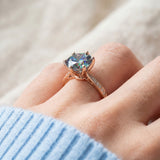 3 Carat Mystic Moissanite Ring in rose gold, worn on a model, side profile