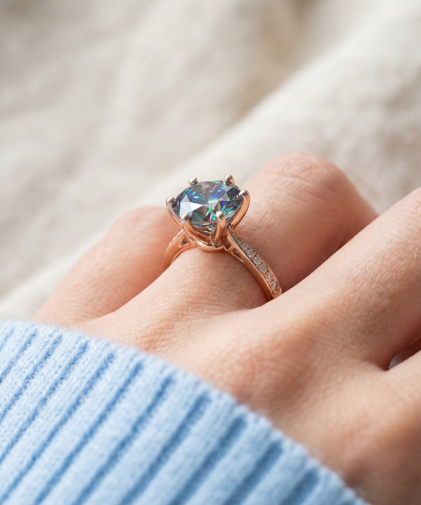 3 Carat Mystic Moissanite Ring in rose gold, worn on a model, side profile