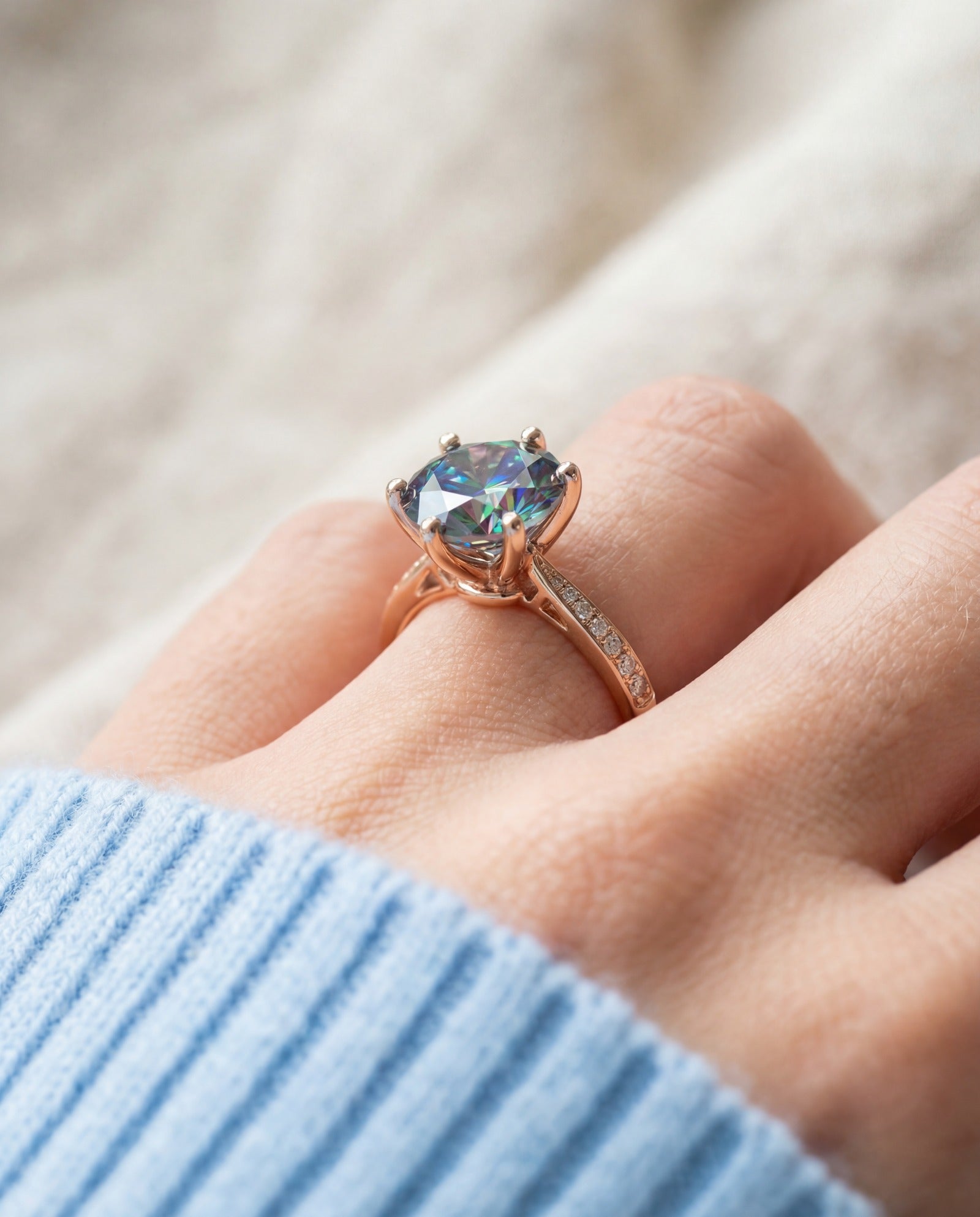 3 Carat Mystic Moissanite Ring in rose gold, worn on a model, side profile