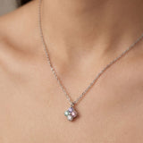 Front view of the Tale of Two Clovers pendant in silver, worn by a model to show everyday scale and fit.