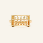 A yellow gold abacus ring featuring a rectangular frame with golden beads and yellow citrine stones, designed to mimic a traditional abacus, adding a playful and unique touch to your jewelry collection.