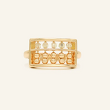 A yellow gold abacus ring featuring a rectangular frame with golden beads and yellow citrine stones, designed to mimic a traditional abacus, adding a playful and unique touch to your jewelry collection.