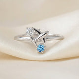 Wanderlust Ring | Moissanite in silver, laid flat on a tabletop