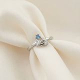 Wanderlust Ring | Moissanite in silver, laid flat on a tabletop