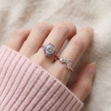 Arc White Moissanite Ring in rose gold, worn on a model