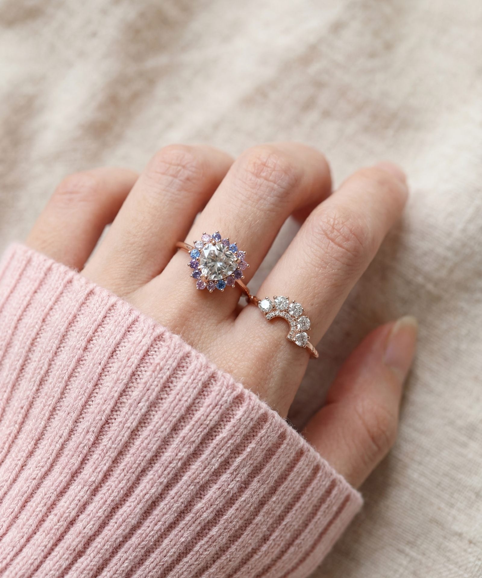 Arc White Moissanite Ring in rose gold, worn on a model