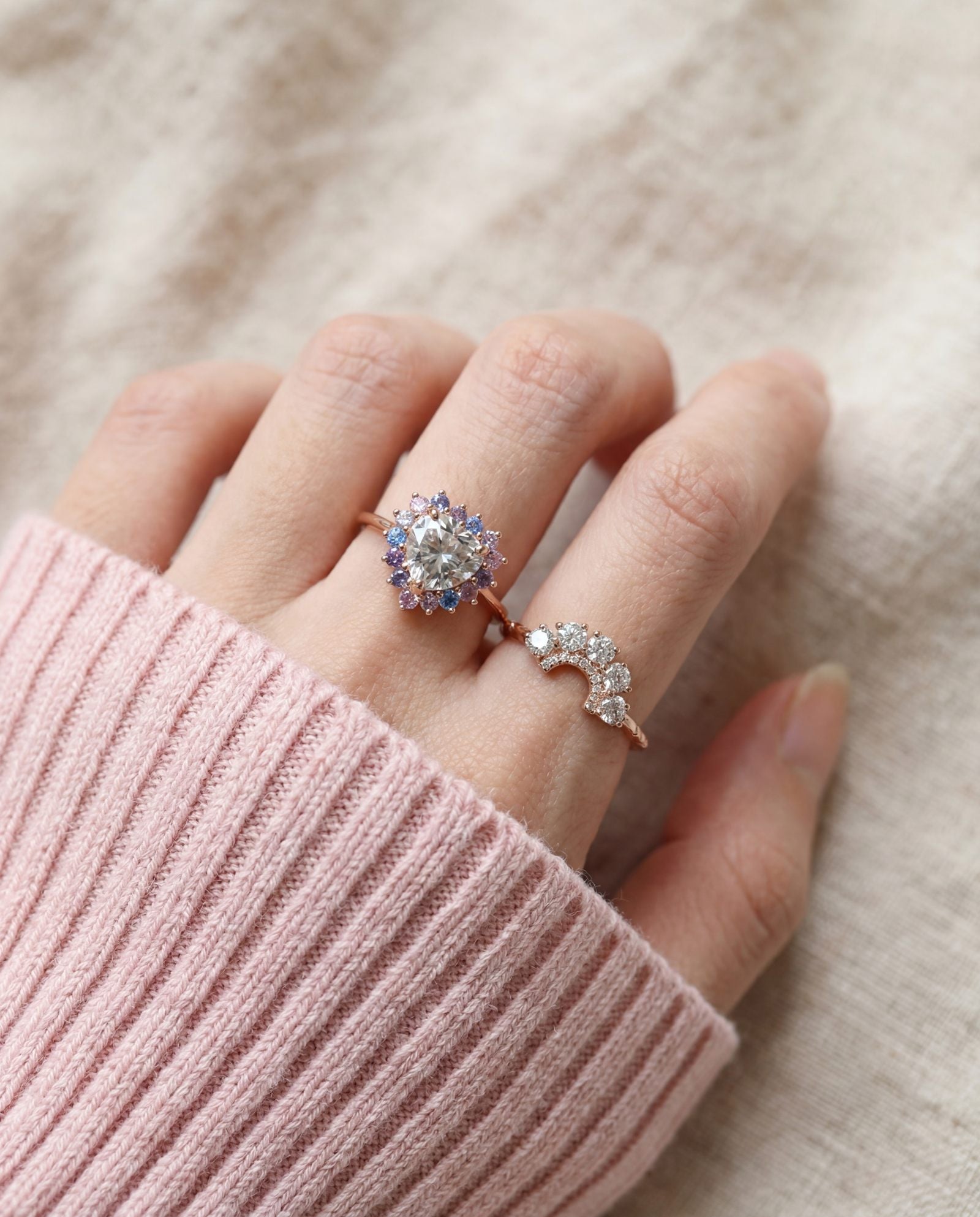 Arc White Moissanite Ring in rose gold, worn on a model