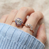 Arc White Moissanite Ring in rose gold, worn on a model, alternate angle