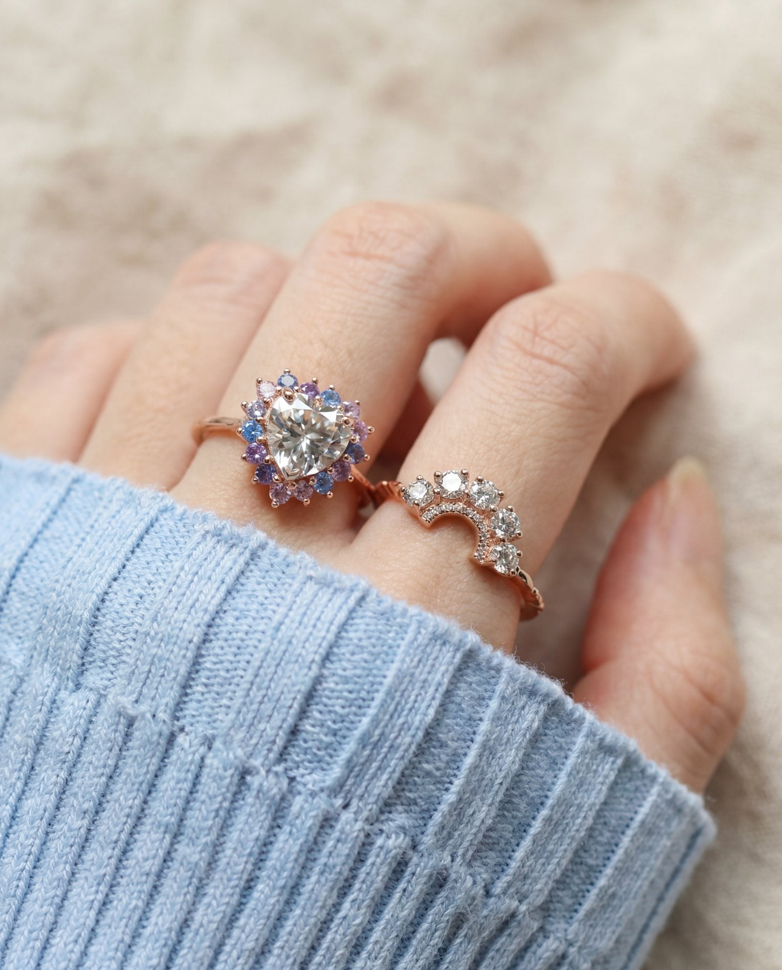 Arc White Moissanite Ring in rose gold, worn on a model, alternate angle
