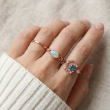 Astra Opal Ring in rose gold, worn on a model