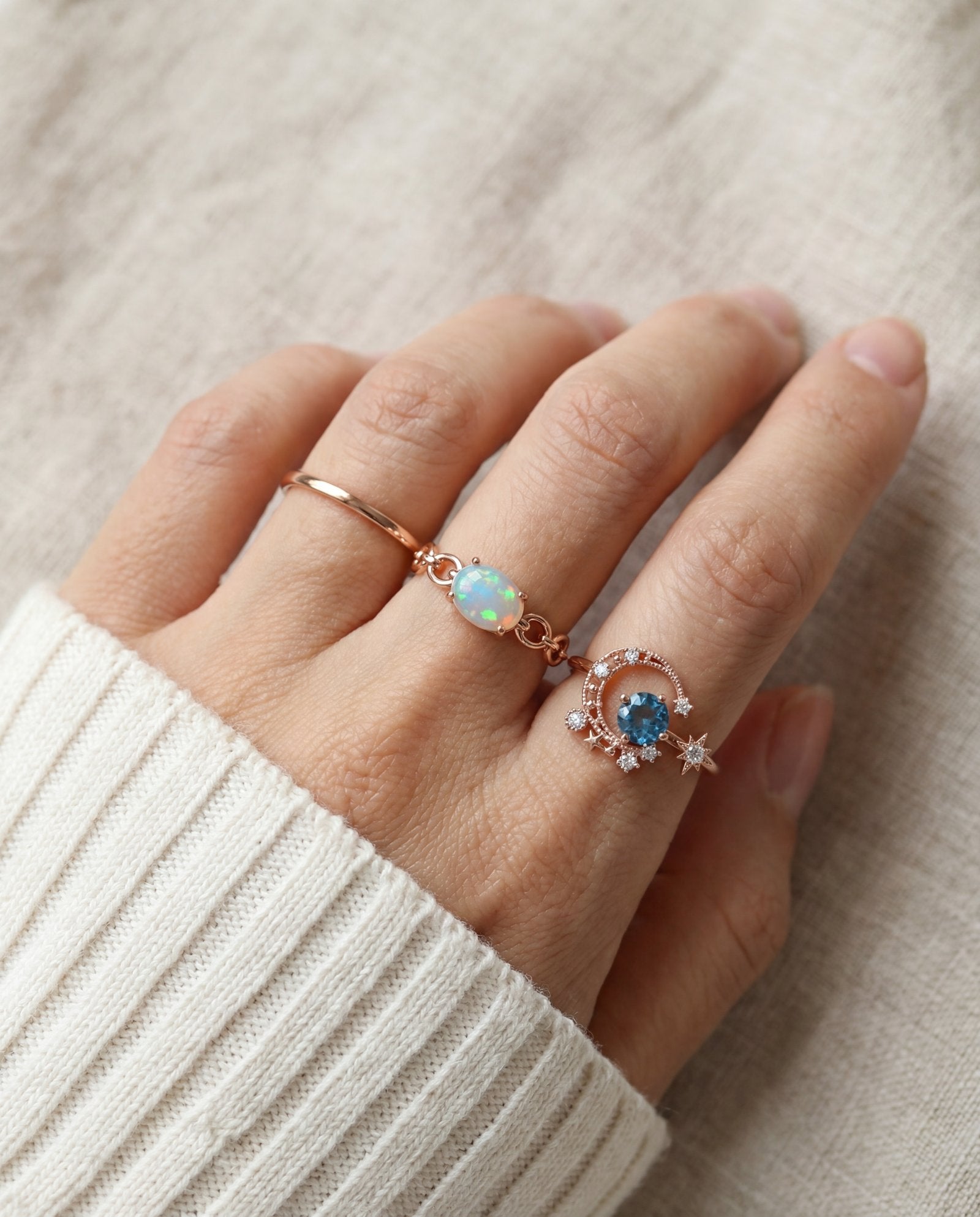 Astra Opal Ring in rose gold, worn on a model