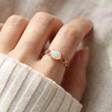 Astra Opal Ring in rose gold, worn on a model, alternate angle