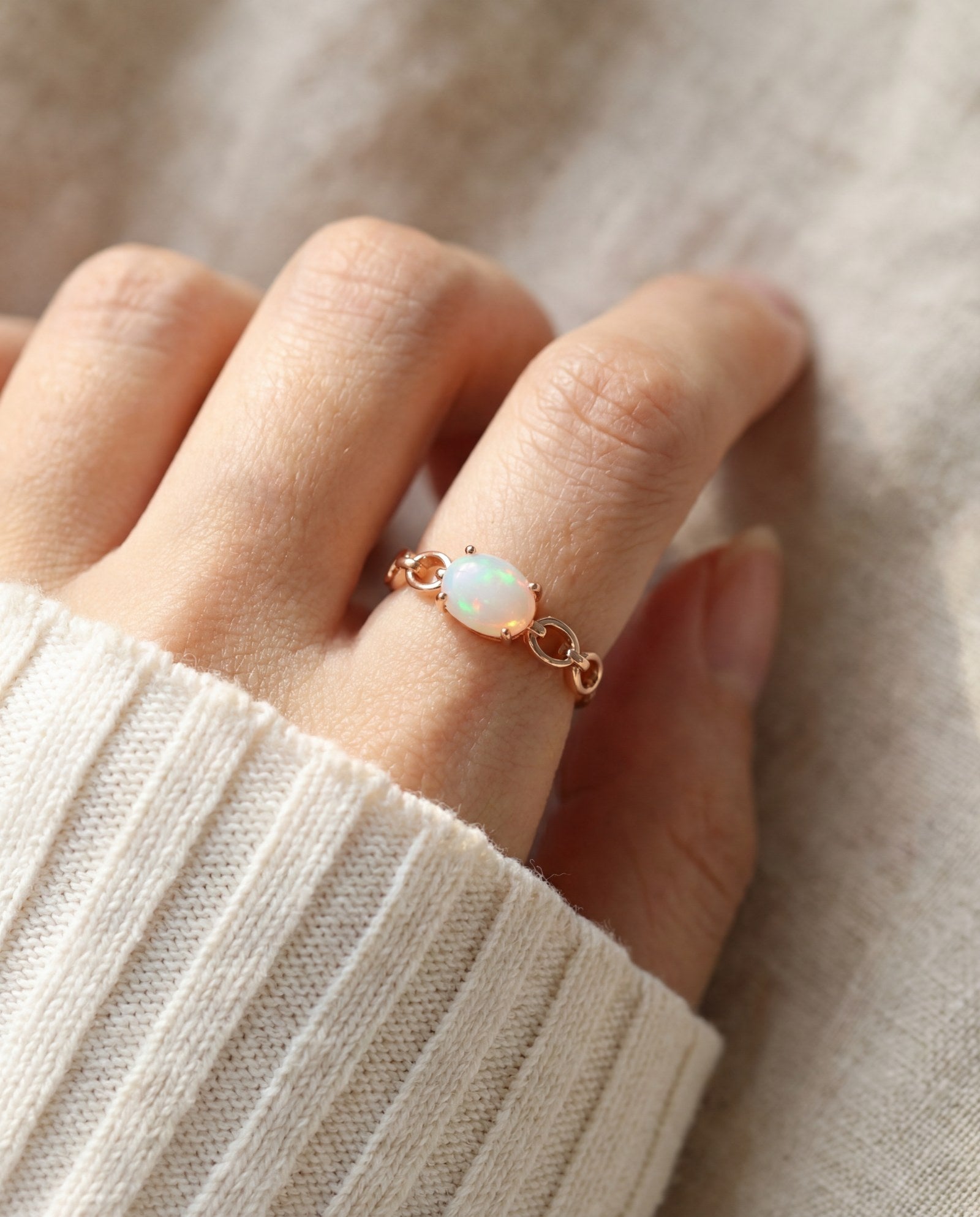 Astra Opal Ring in rose gold, worn on a model, alternate angle