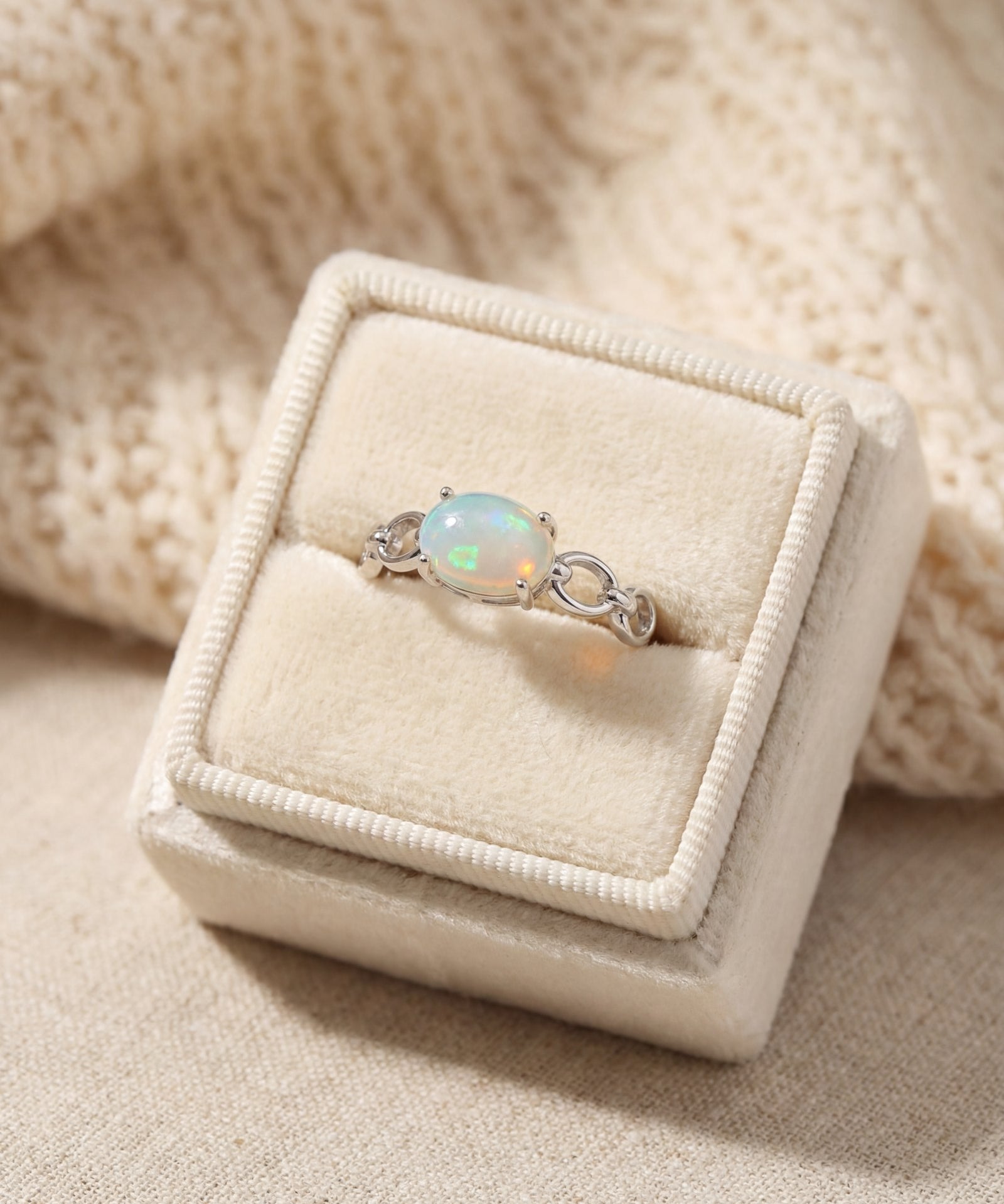 Astra Opal Ring in silver, laid flat on a tabletop