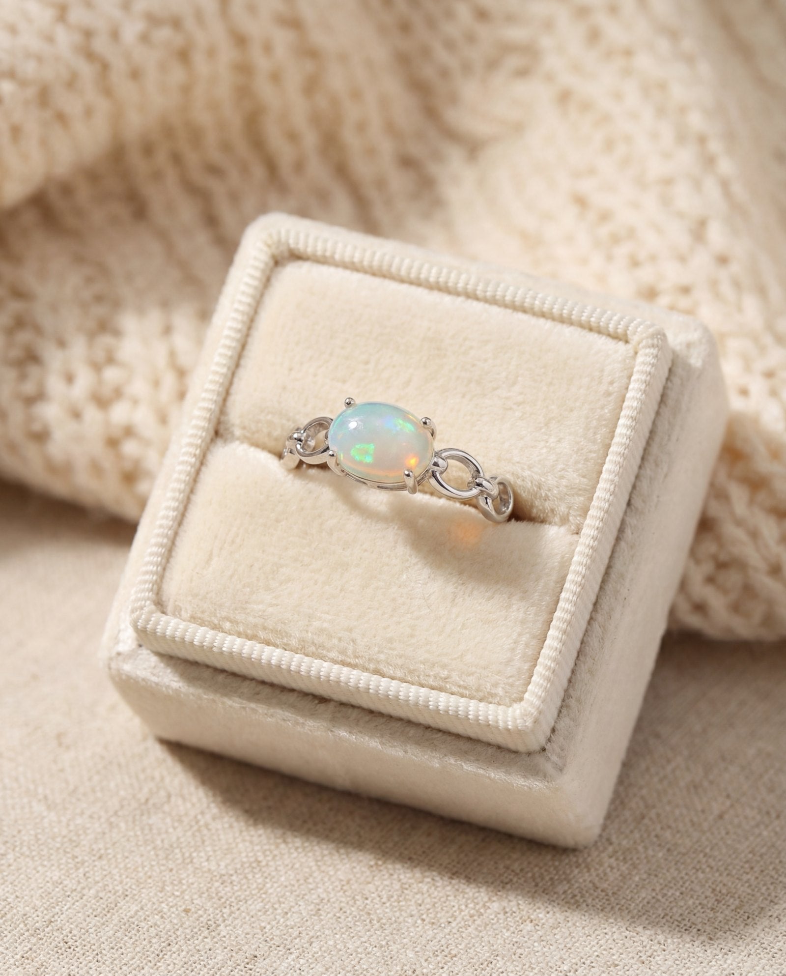 Astra Opal Ring in silver, laid flat on a tabletop
