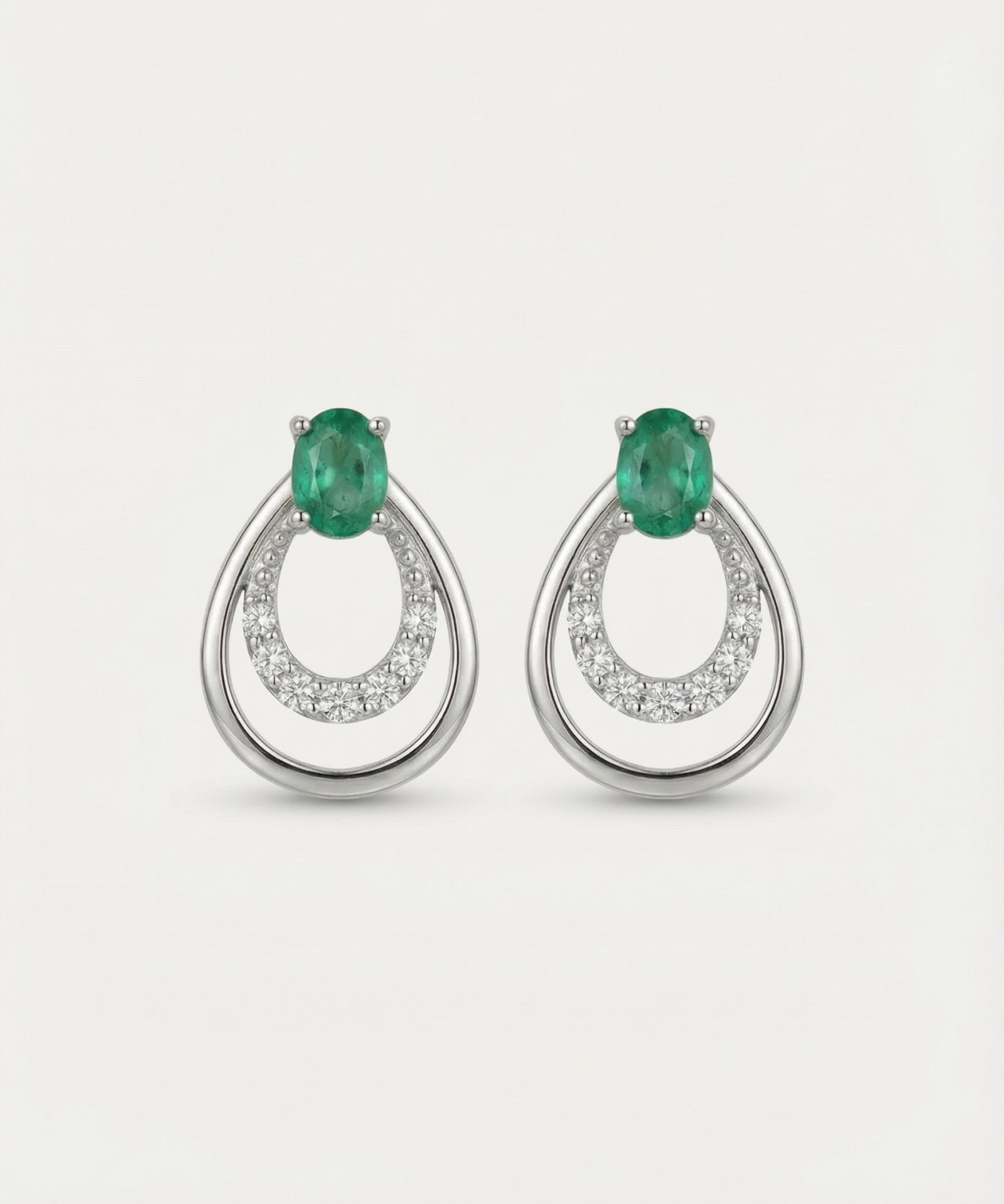 Professional product shot of Aura Emerald Drop Studs in Silver with a clean white background.