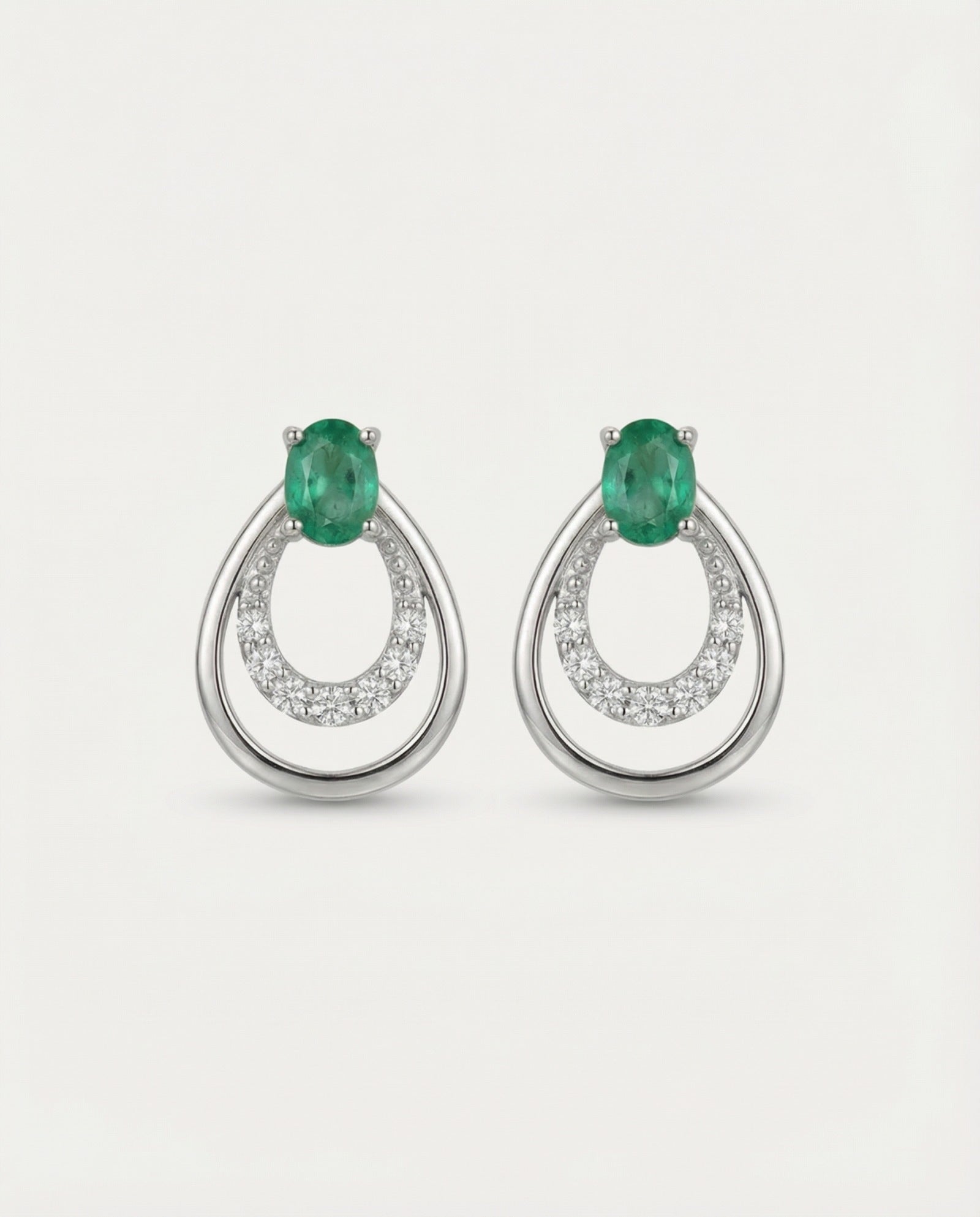 Professional product shot of Aura Emerald Drop Studs in Silver with a clean white background.