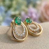 Side view of Aura Emerald Drop Studs in 18k Yellow Gold featuring a nested double teardrop silhouette.