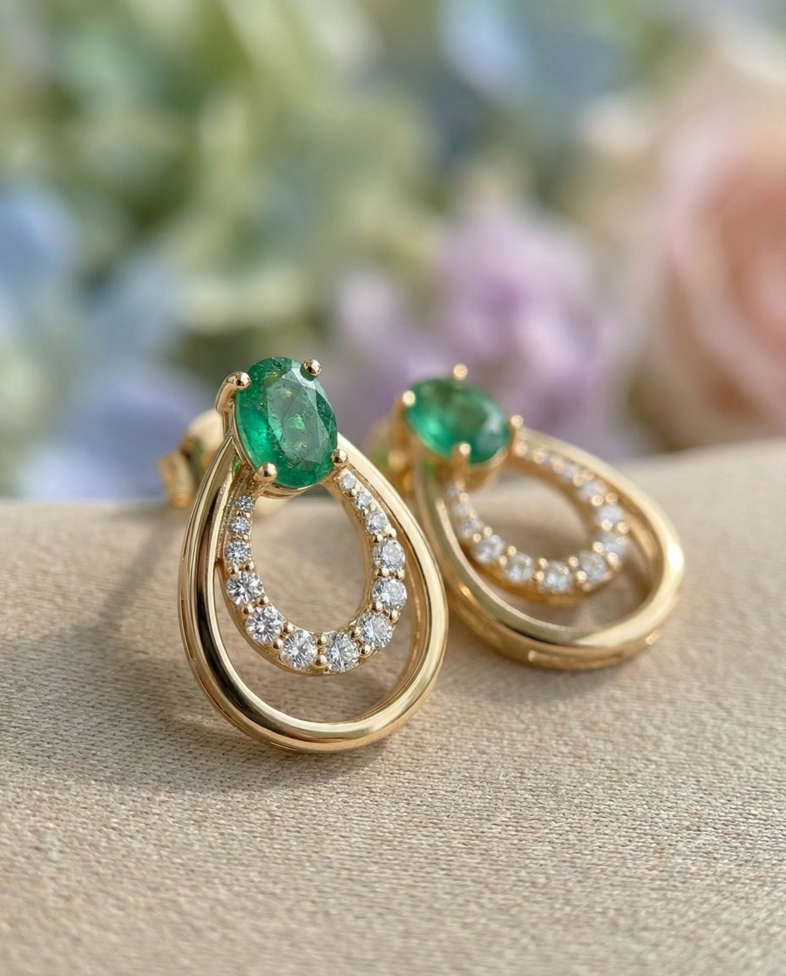 Side view of Aura Emerald Drop Studs in 18k Yellow Gold featuring a nested double teardrop silhouette.