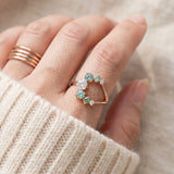 Aurora Crescent Moissanite Ring in rose gold, worn on a model