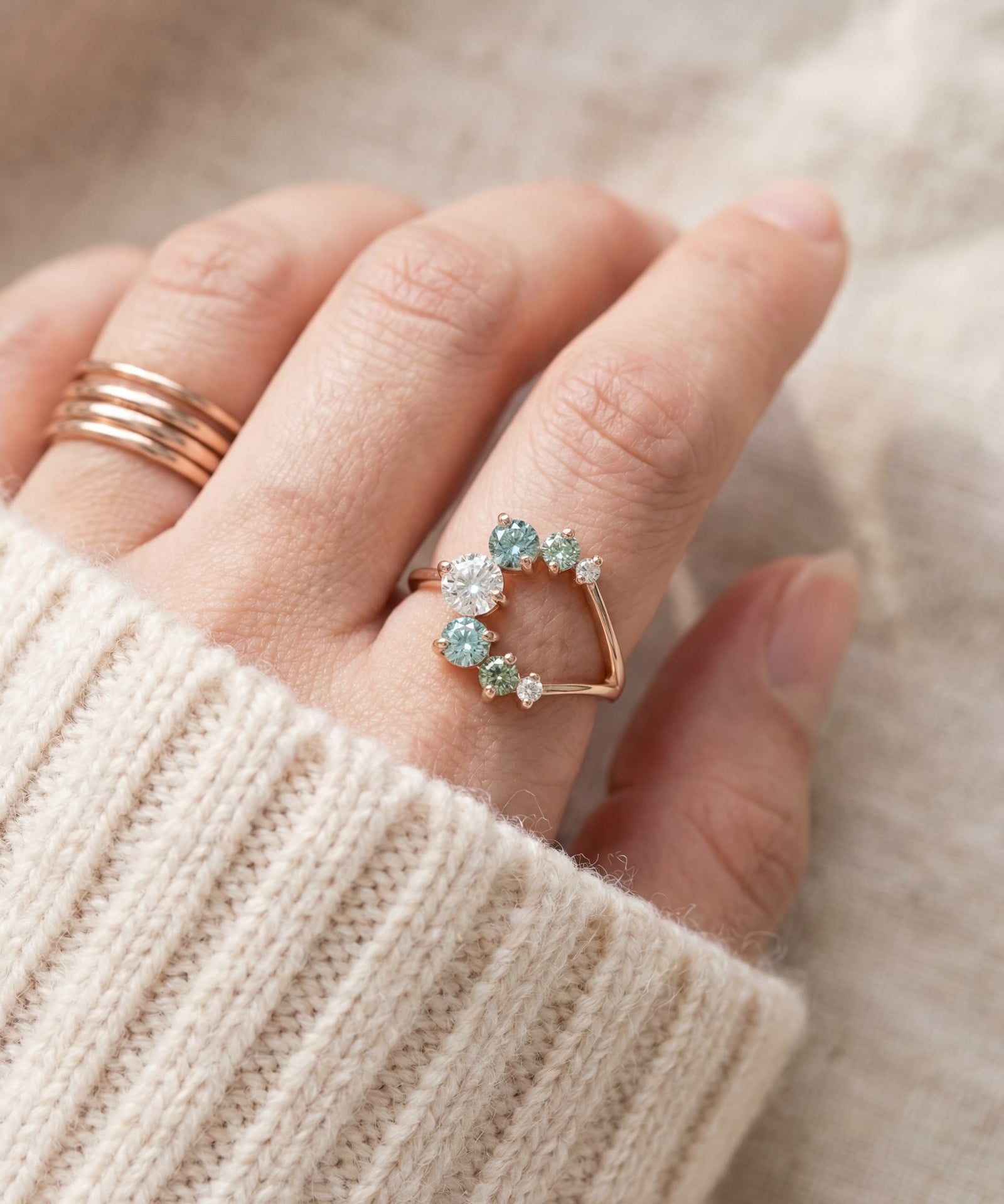 Aurora Crescent Moissanite Ring in rose gold, worn on a model