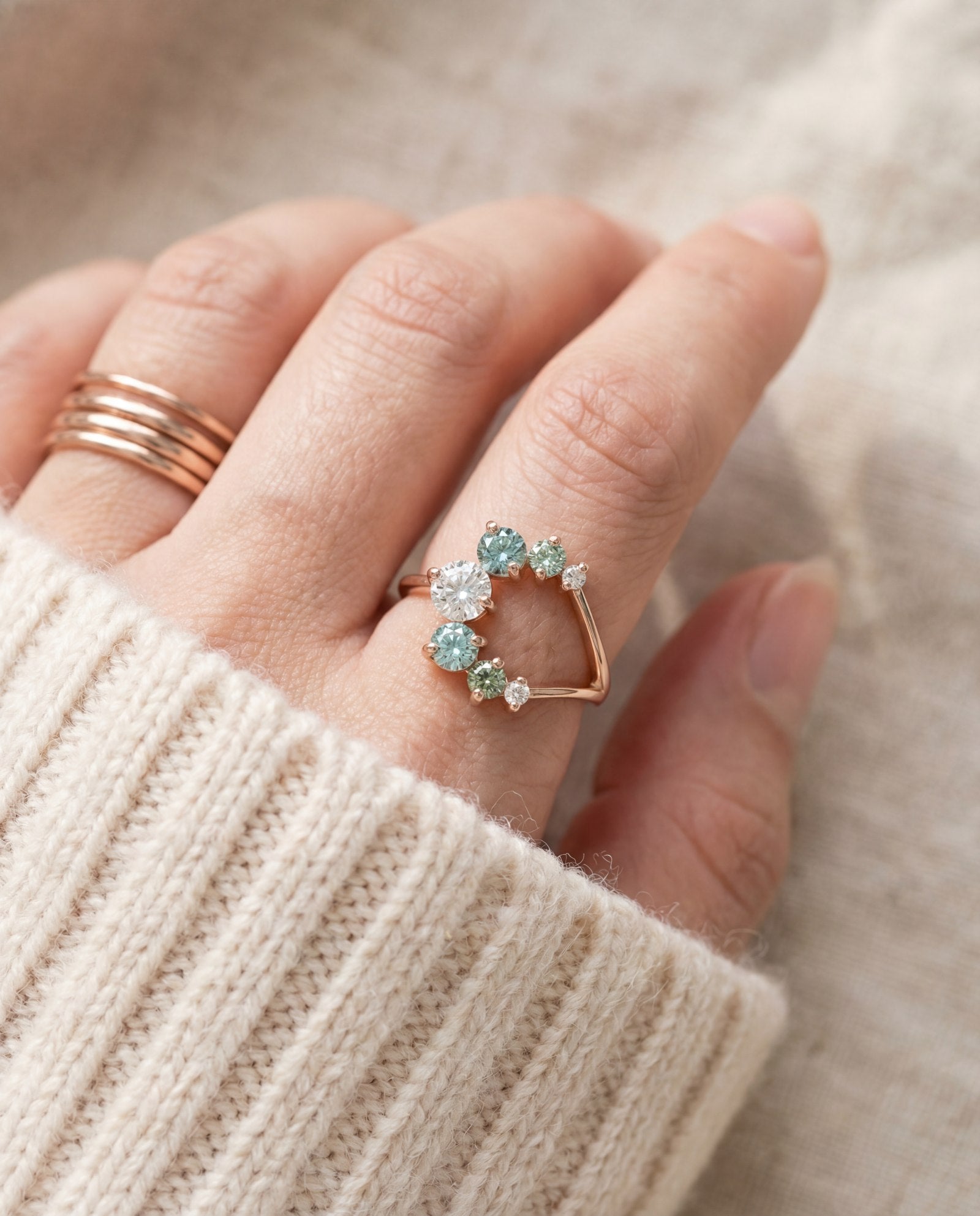 Aurora Crescent Moissanite Ring in rose gold, worn on a model