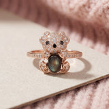 Black Sunstone Koala Bear Ring in rose gold, laid flat on a tabletop