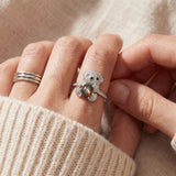 Black Sunstone Koala Bear Ring in silver, worn on a model, stacked with other rings