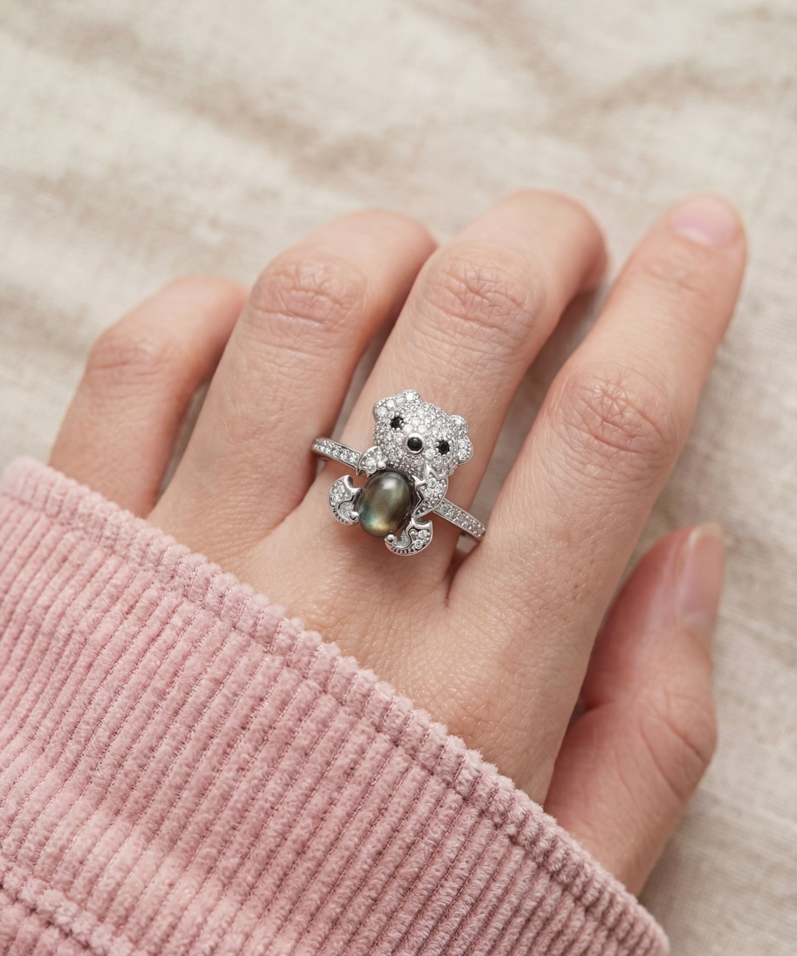 Black Sunstone Koala Bear Ring in silver, worn on a model