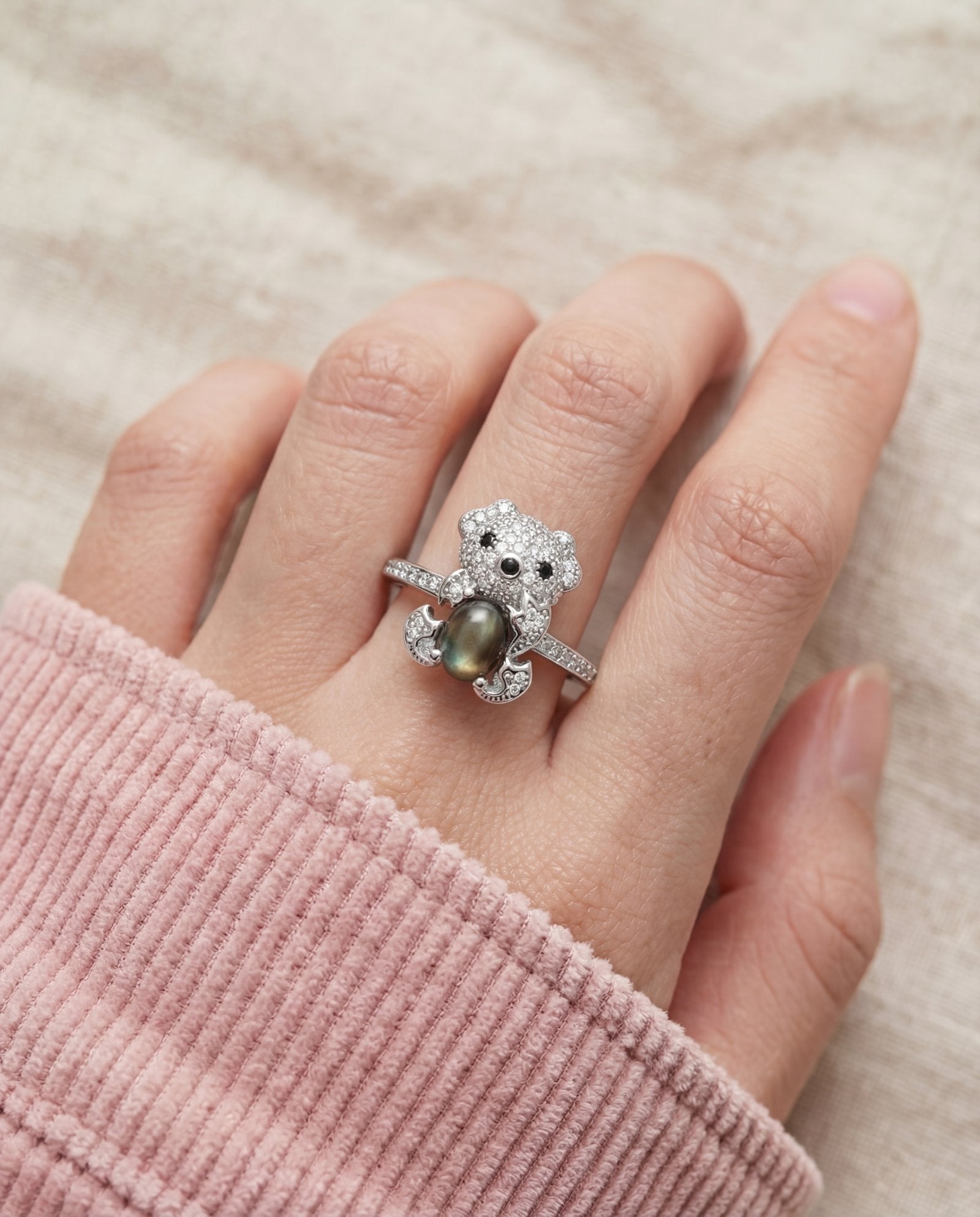 Black Sunstone Koala Bear Ring in silver, worn on a model
