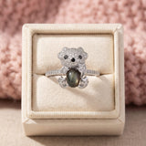 Black Sunstone Koala Bear Ring in silver, laid flat on a tabletop