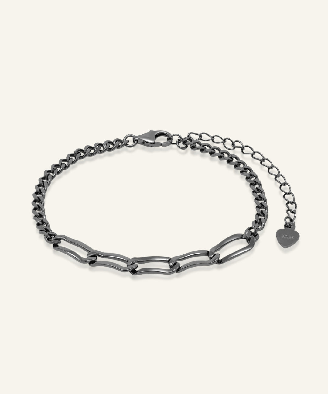 Boyfriend Curb Bracelet | Elate in black gold, resting on a warm linen background