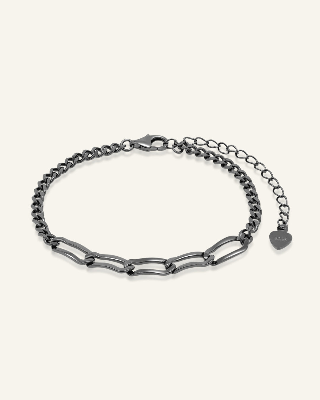 Boyfriend Curb Bracelet | Elate in black gold, resting on a warm linen background