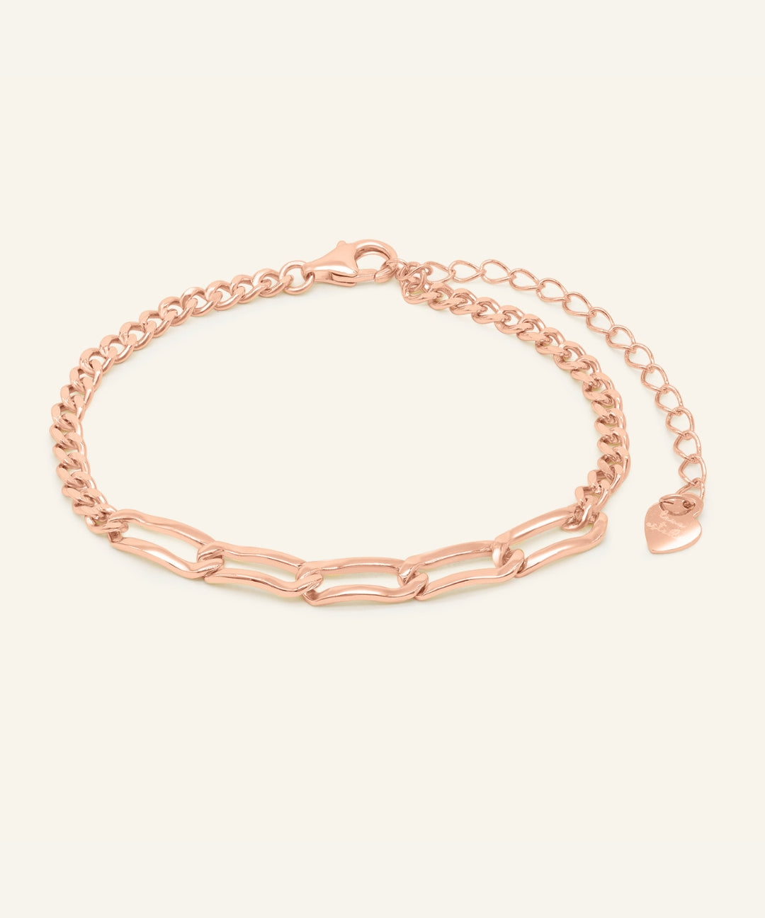 Boyfriend Curb Bracelet | Elate in rose gold, resting on a warm linen background