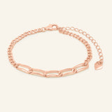 Boyfriend Curb Bracelet | Elate in rose gold, resting on a warm linen background