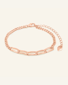 Boyfriend Curb Bracelet | Elate in rose gold, resting on a warm linen background