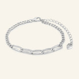 Boyfriend Curb Bracelet | Elate in silver, resting on a warm linen background