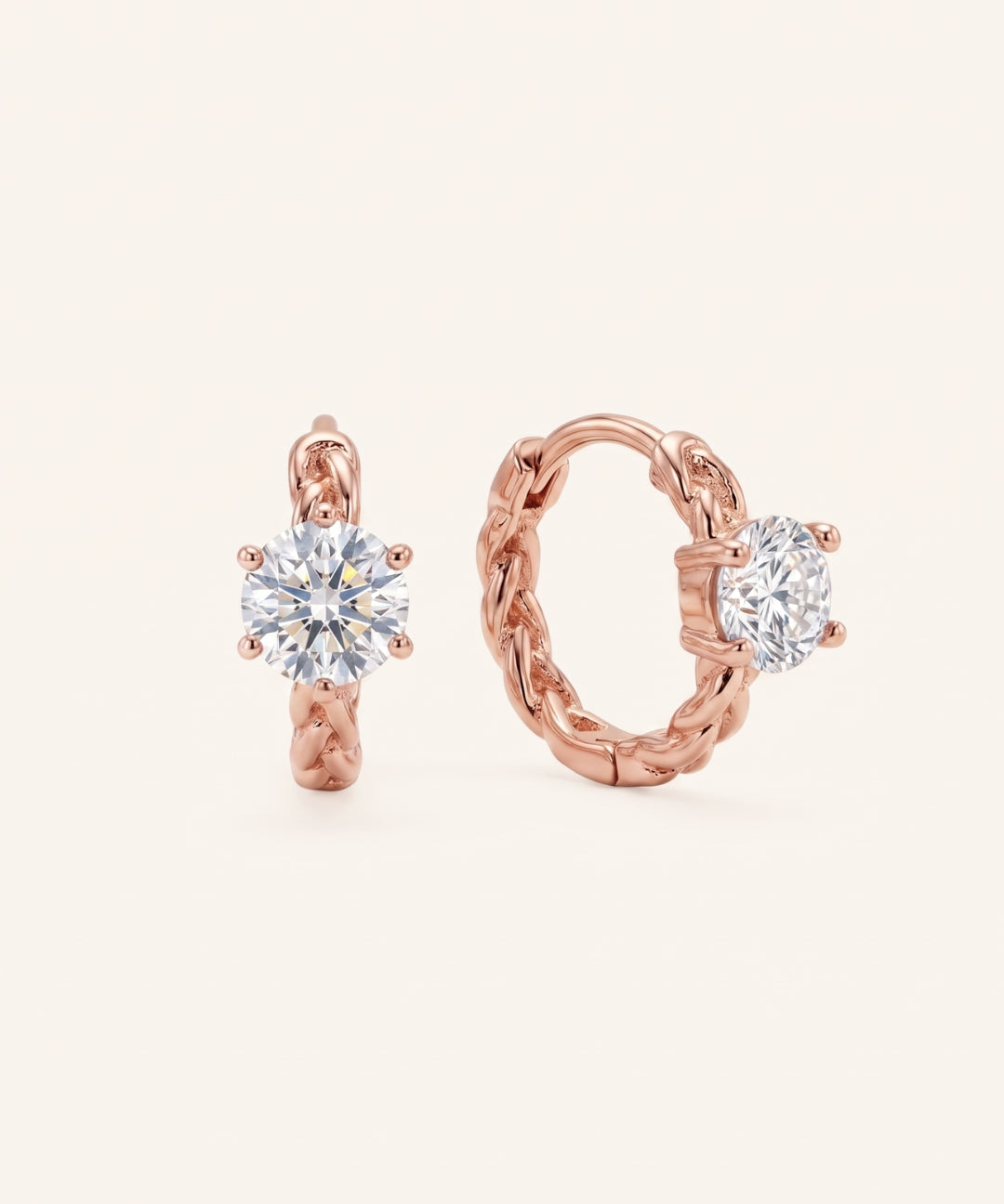 Pair of 18k rose gold vermeil Braided Moissanite Huggie Hoops featuring 0.5ct round white moissanite solitaire stones.