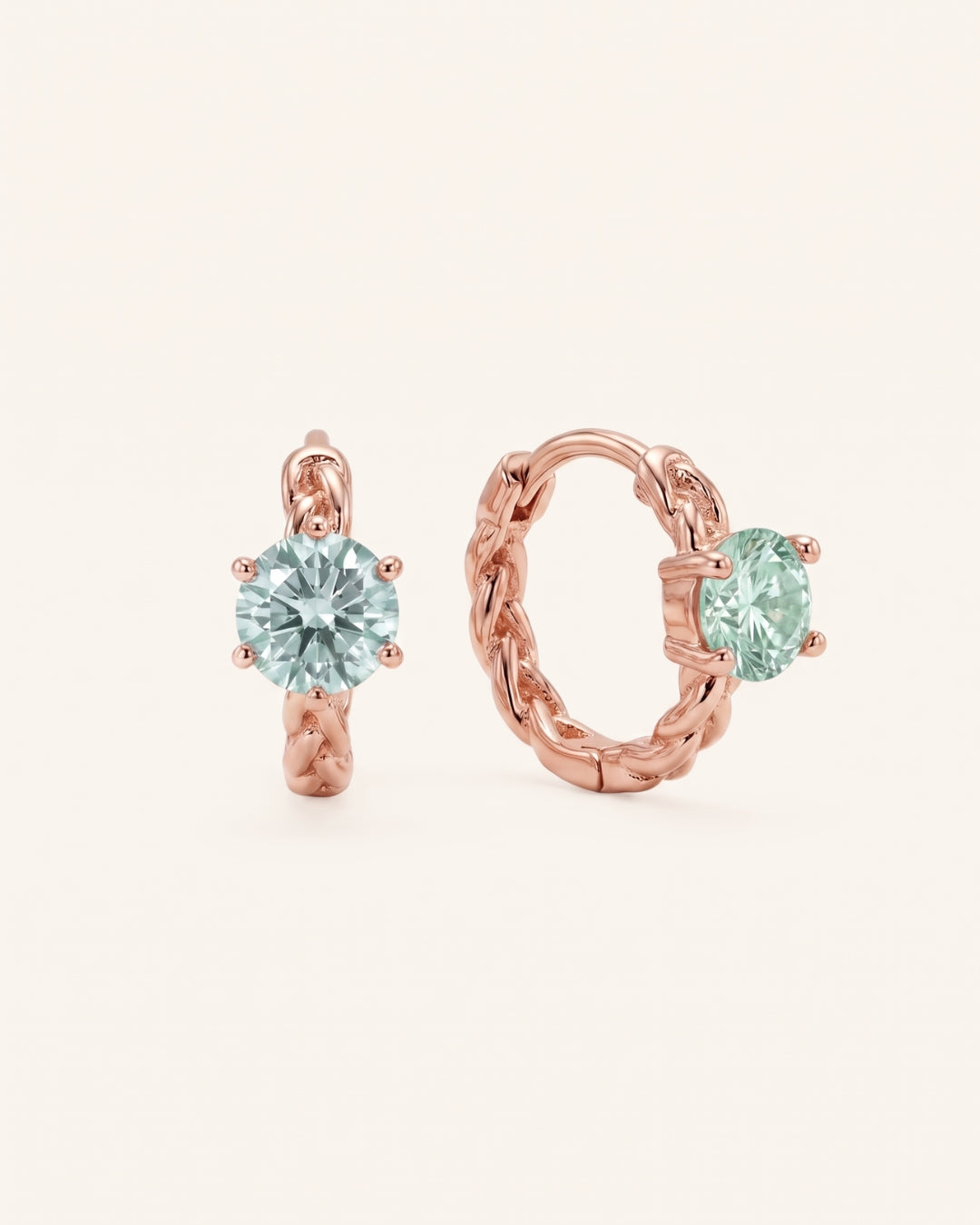 Pair of 18k rose gold vermeil Braided Mint Moissanite Huggie Hoops with 0.5ct round pastel green moissanite solitaire center stones.