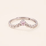 Sterling silver Braided Wishbone Moissanite Ring set with a 0.1ct pastel pink moissanite center stone.