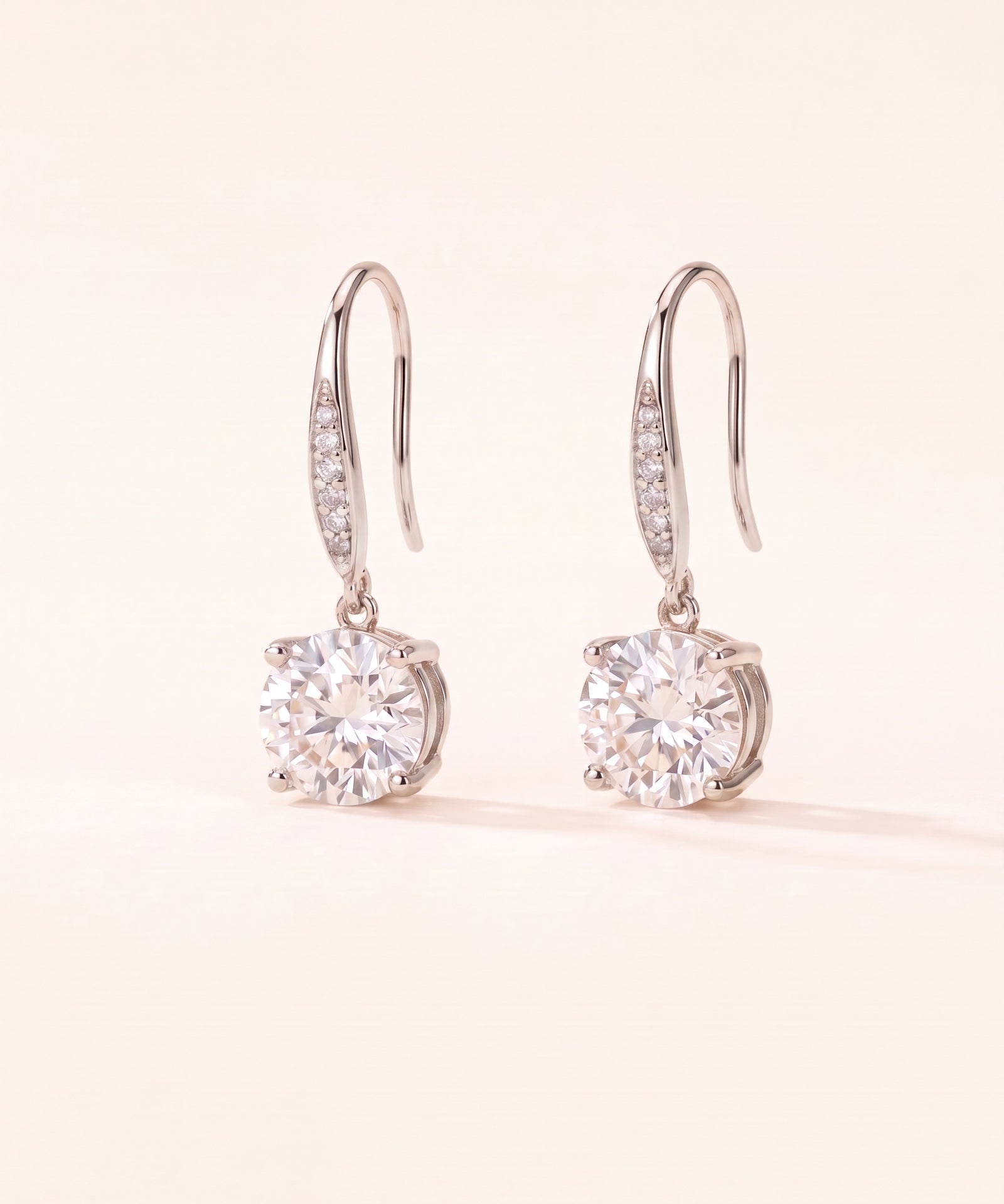 Studio pair shot of 925 sterling silver Candlelight Moissanite Solitaire Hooks with pavé wire details.