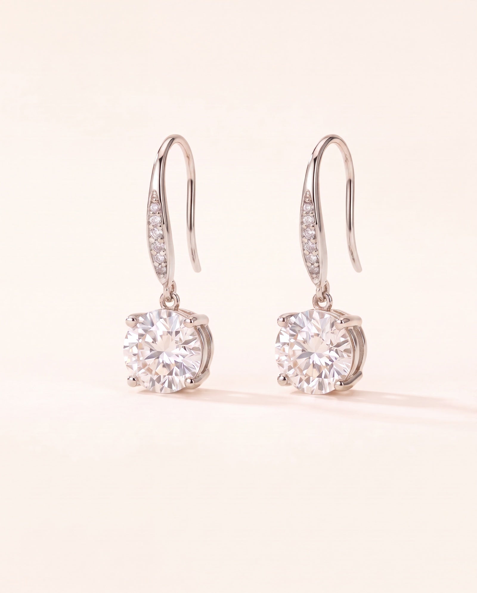 Studio pair shot of 925 sterling silver Candlelight Moissanite Solitaire Hooks with pavé wire details.