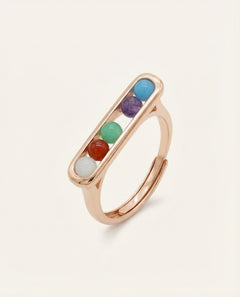 Candy Bar Ring | Interactive in rose gold, resting on a warm linen background