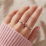 Candy Cane Ribbon Ring | Rose Quartz in yellow gold, worn on a model