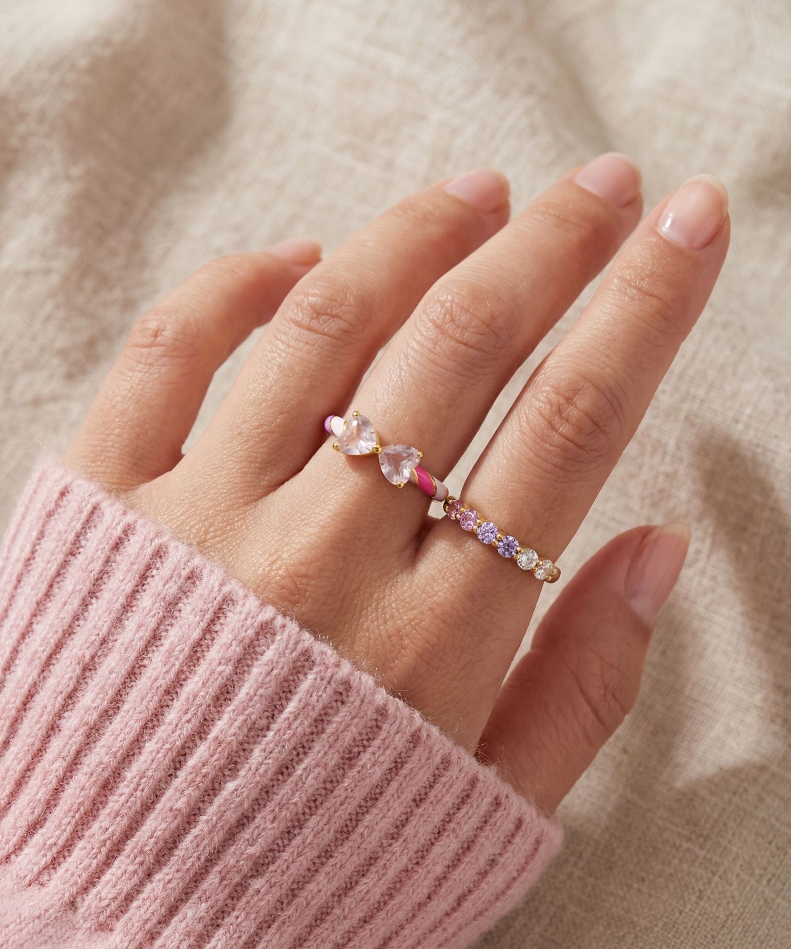 Candy Cane Ribbon Ring | Rose Quartz in yellow gold, worn on a model