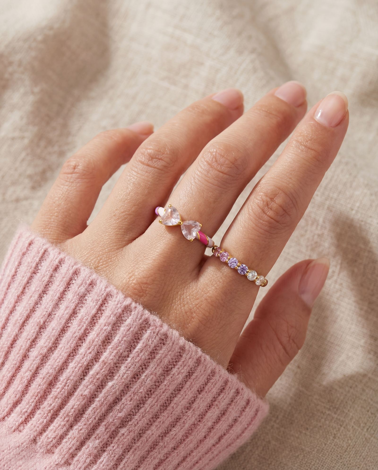 Candy Cane Ribbon Ring | Rose Quartz in yellow gold, worn on a model