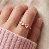 Candy Cane Ribbon Ring | Rose Quartz in yellow gold, worn on a model