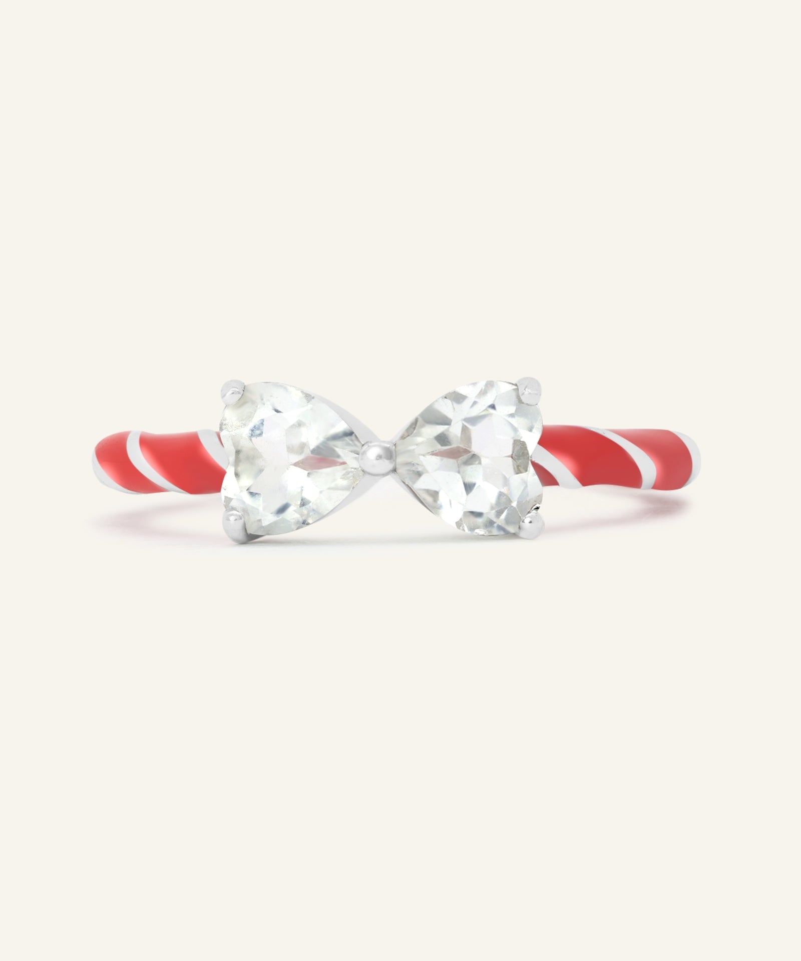 Candy Cane Ribbon Ring | Topaz, resting on a warm linen background